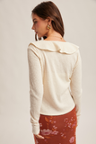 38674 Ruffle Ivory Cardigan